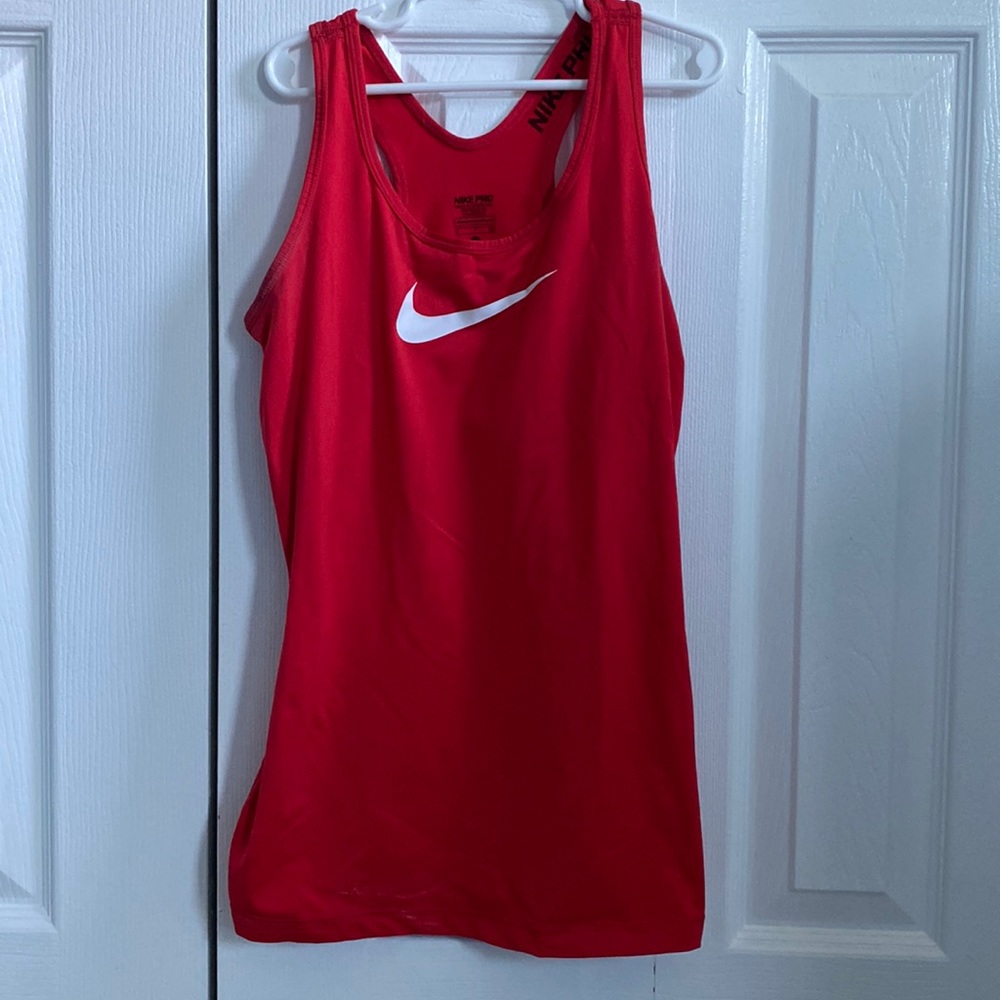 Red Nike athletic dry fit tank top.